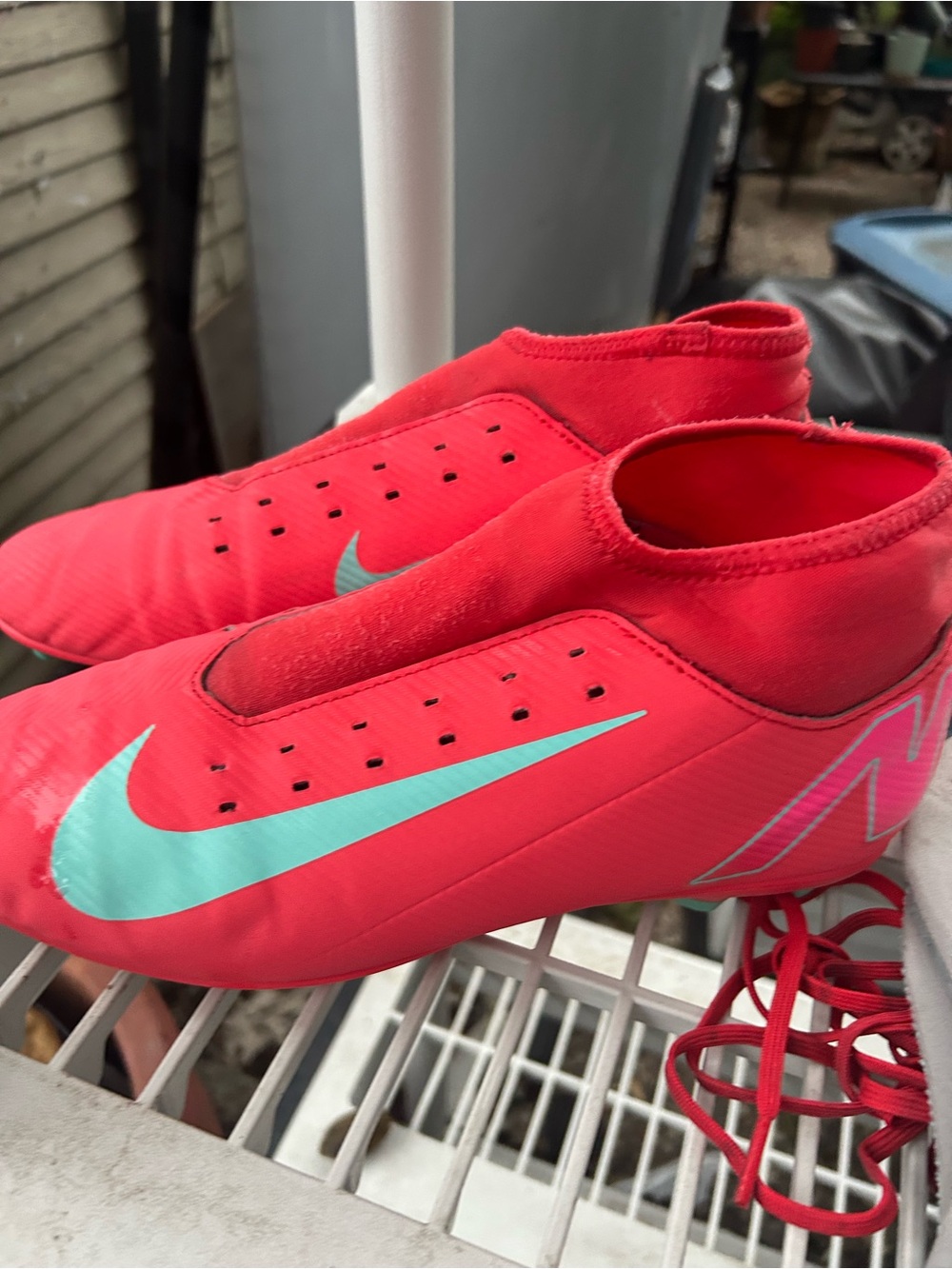 Nike Kids Red Soccer Cleats with Teal Swoosh